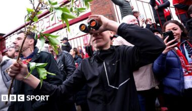 A fan is seen using binoculars outside the stadium prior to the Championship play-off semi-final match between Middlesbrough and Southampton at Riverside Stadium