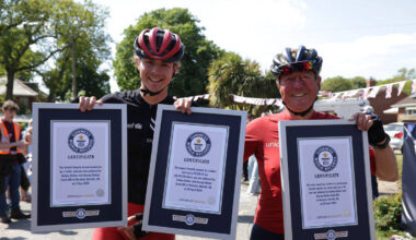 Father and son set three new world records after round-the-world charity cycle
