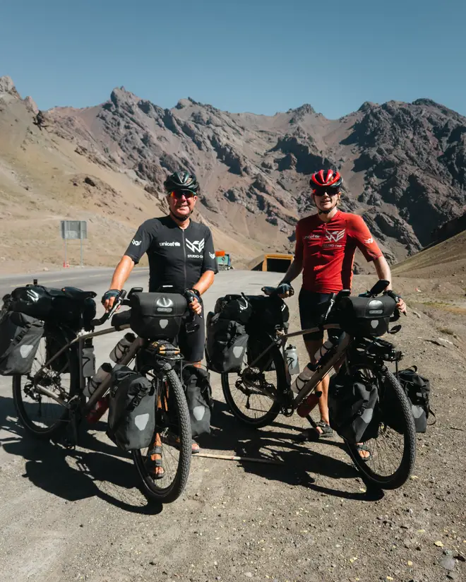 The pair at the top of the Andes pass, Chile and Argentina border