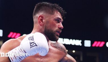 Joe Cordina side-on in the ring with gloved right fist raised