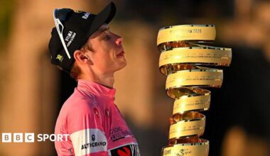 Jonas Vingegaard holds the Giro d'Italia trophy