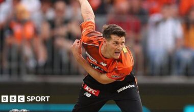 David Payne leans forward after bowling the ball during a match for Perth Scorchers