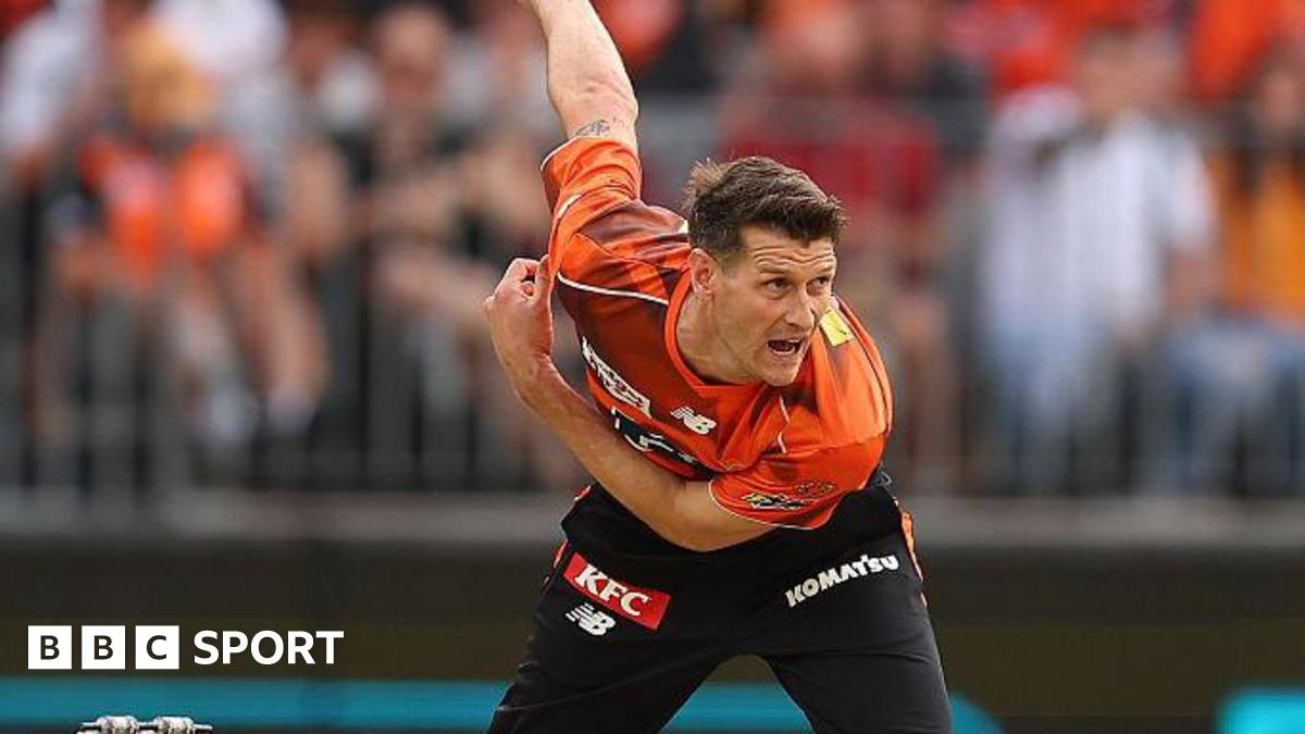 David Payne leans forward after bowling the ball during a match for Perth Scorchers
