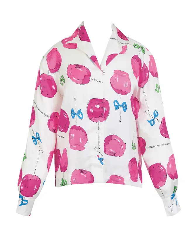 White silk blouse featuring a pattern of pink candy apples.