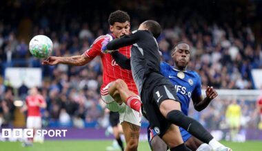 Nottingham Forest's Morgan Gibbs-White and Chelsea goalkeeper Robert Sanchez collide while going for the ball