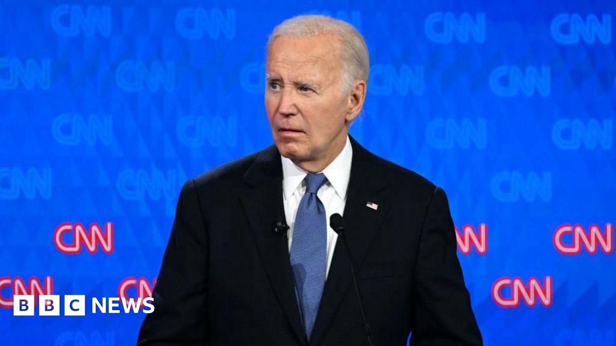 Joe Biden gestures while speaking at a podium at North Carolina State Fairgrounds in Raleigh, North Carolina, on 28 June