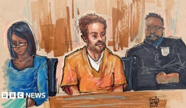 A 30 April 2026 courtroom sketch of Cole Tomas Allen, the suspect in the White House Correspondents' Dinner shooting, depicts him sitting in a courtroom in an orange jumper during a hearing after being charged with attempting to assassinate US President Donald Trump, in Washington DC.