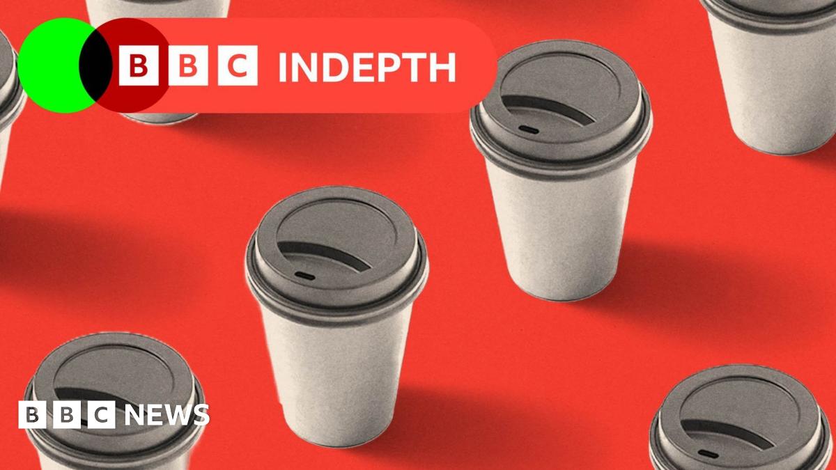 A coffee in a mug, with an imprint of Donald Trump in the foam
