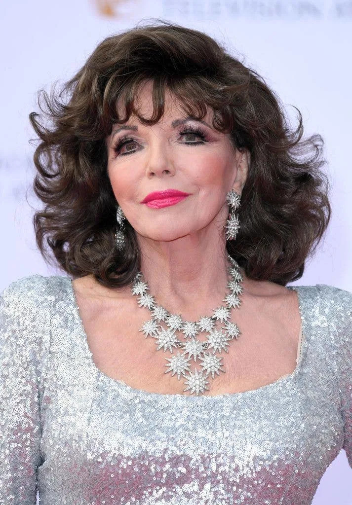 Dame Joan Collins in silver sequin dress