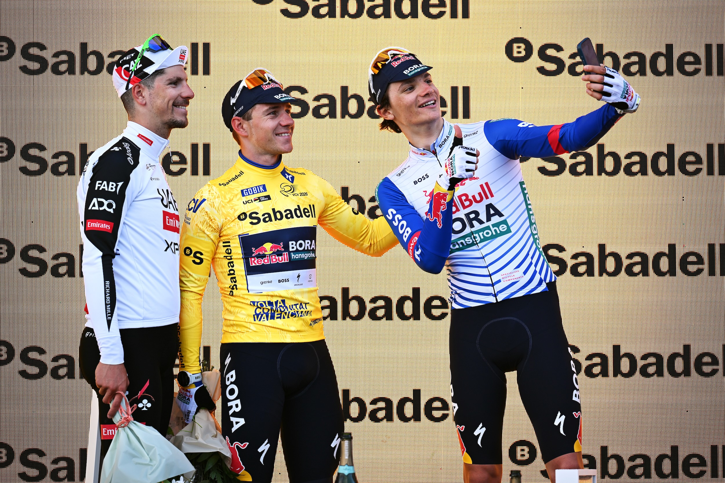 (L-R) Joao Almeida of Portugal UAE Team Emirates - XRG on second place, race winner Remco Evenepoel of Belgium and Team Red Bull - BORA - hansgrohe and Giulio Pellizzari of Italy and Team Red Bull - BORA - hansgrohe on third place pose on the podium ceremony after the 77th Volta Comunitat Valenciana 2026, Stage 5