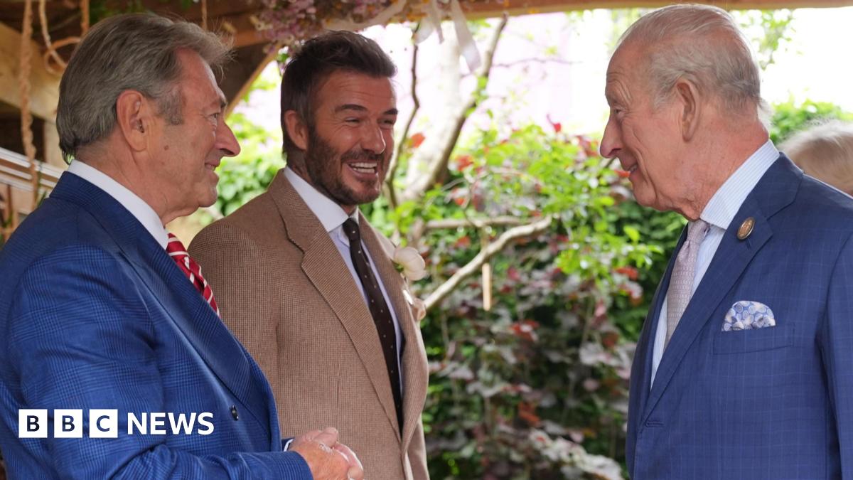 King Charles III and Queen Camilla, watched by Sir David Beckham (right) view the RHS and The King's Foundation Curious Garden