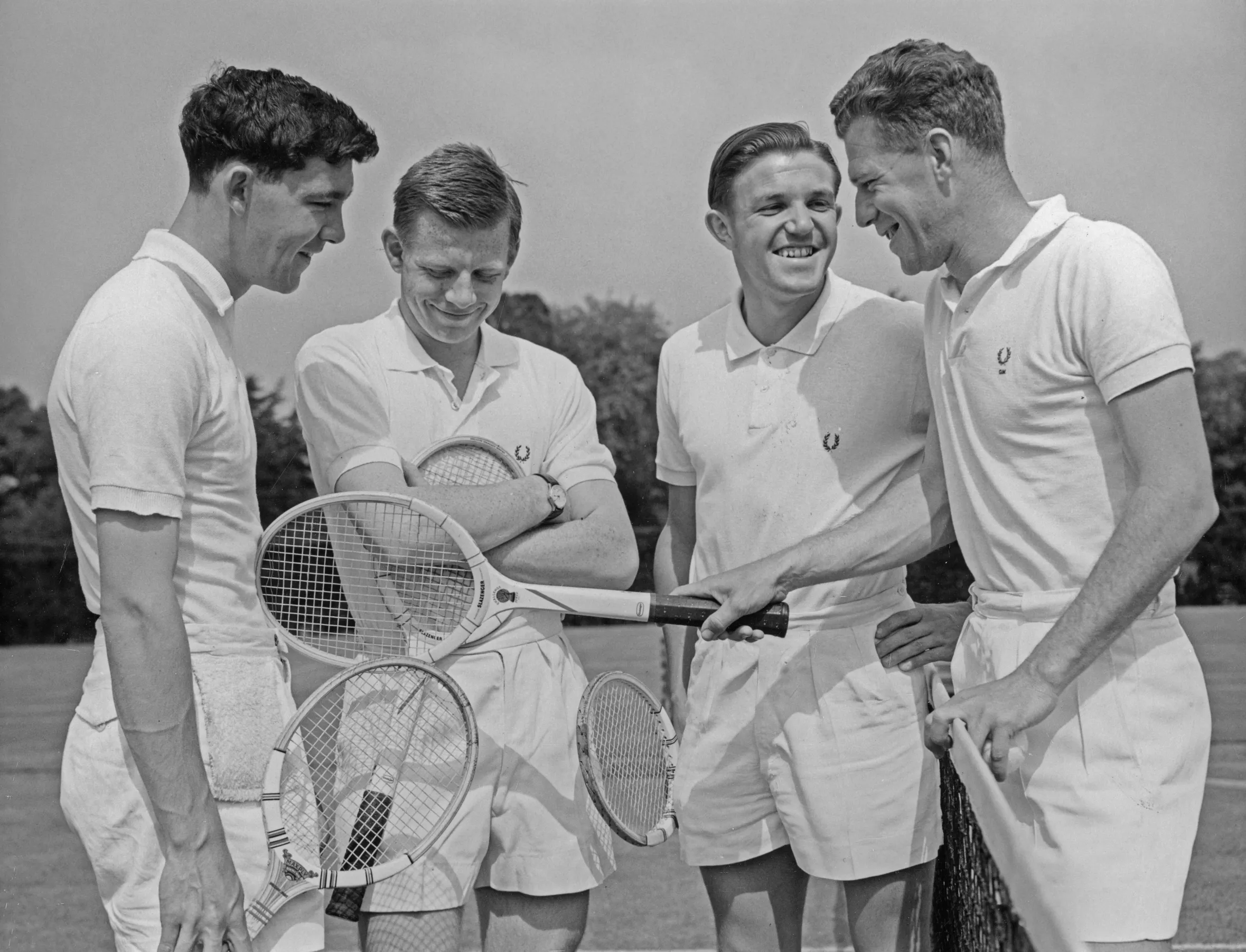 British Davis Cup team tennis players Michael Davies, Billy Knight and Roger Becker with their coach George Worthington during a practice session.