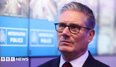Prime Minister Sir Keir Starmer during his visit to a police station in Lambeth, south London. Picture date: Friday May 15, 2026. He is wearing a dark suit and light shirt and is against the backdrop of a Metropolitan Police sign.