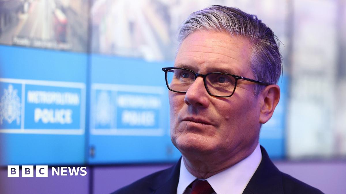 Prime Minister Sir Keir Starmer during his visit to a police station in Lambeth, south London. Picture date: Friday May 15, 2026. He is wearing a dark suit and light shirt and is against the backdrop of a Metropolitan Police sign.