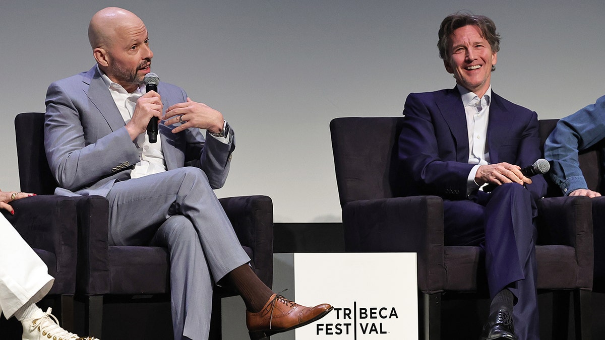 Jon Cryer and Andrew McCarthy standing onstage at the Tribeca Film Festival
