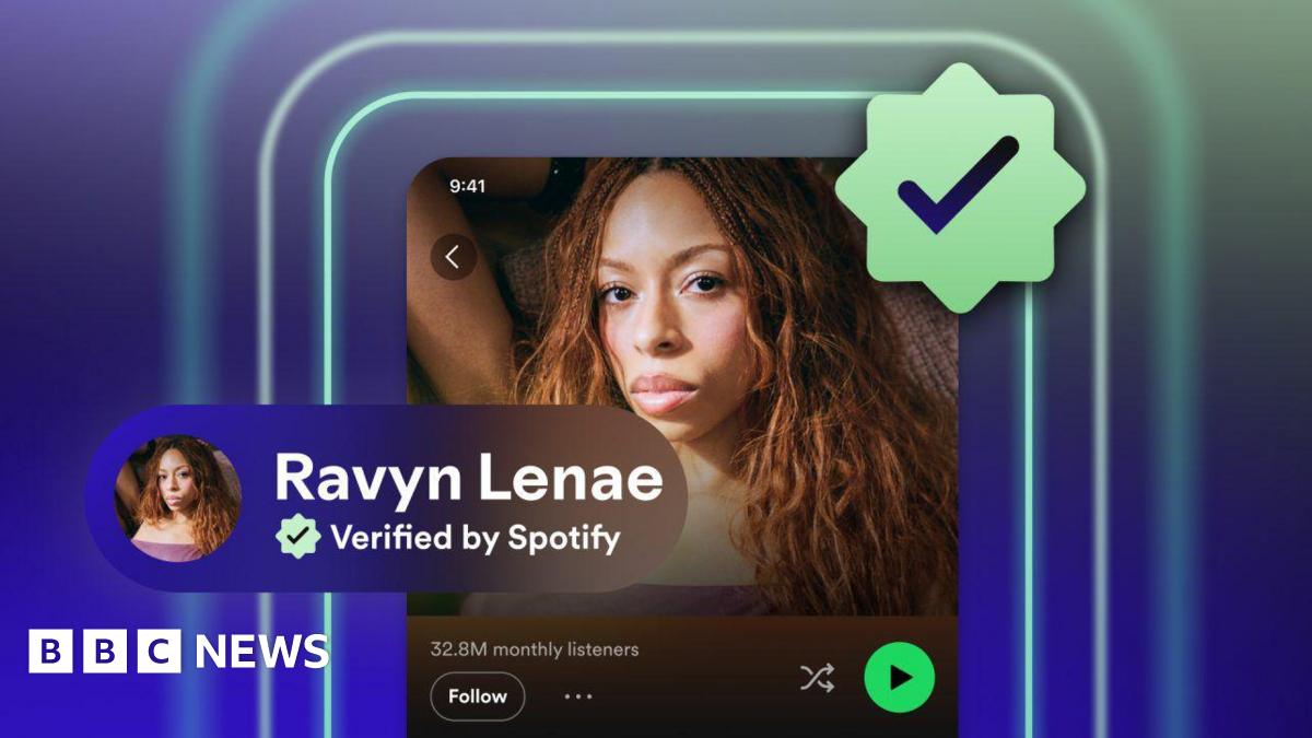 A mock up of the artist Ravyn Lenae's profile on Spotify with a green verified checkmark icon on her profile next to a picture of her staring at the camera with long curly hair. Underneath her picture it says "32.8m monthly listeners".