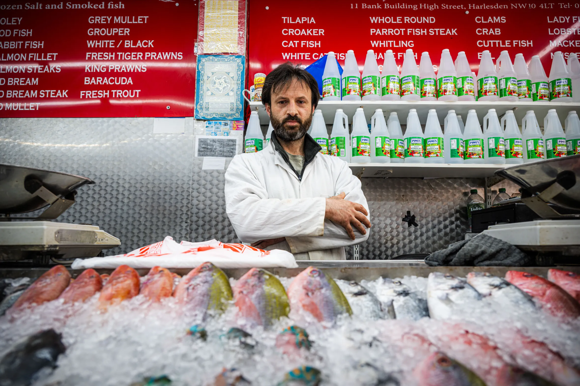 Fishmonger Mohamed Ramal in his shop, Hastee Fresh Fishon, in London.