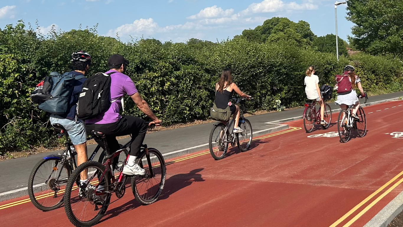 Cyclists riding along Adams Road, Cambridge