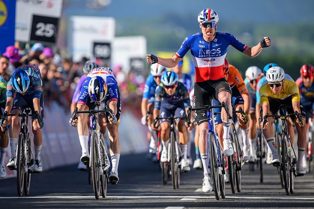 INEOS Grenadiers&rsquo; French rider Dorion Godon (2ndR) celebrates after crossing the finish line winning the third stage of the Tour of Romandie UCI cycling World tour, a 176.6 km loop departing and arriving in Orbe, Switzerland, on May, 1, 2026. (Photo by Fabrice COFFRINI / AFP)