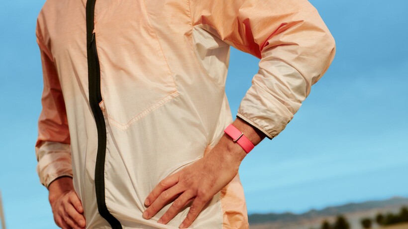 Pink Fitbit Air on wrist