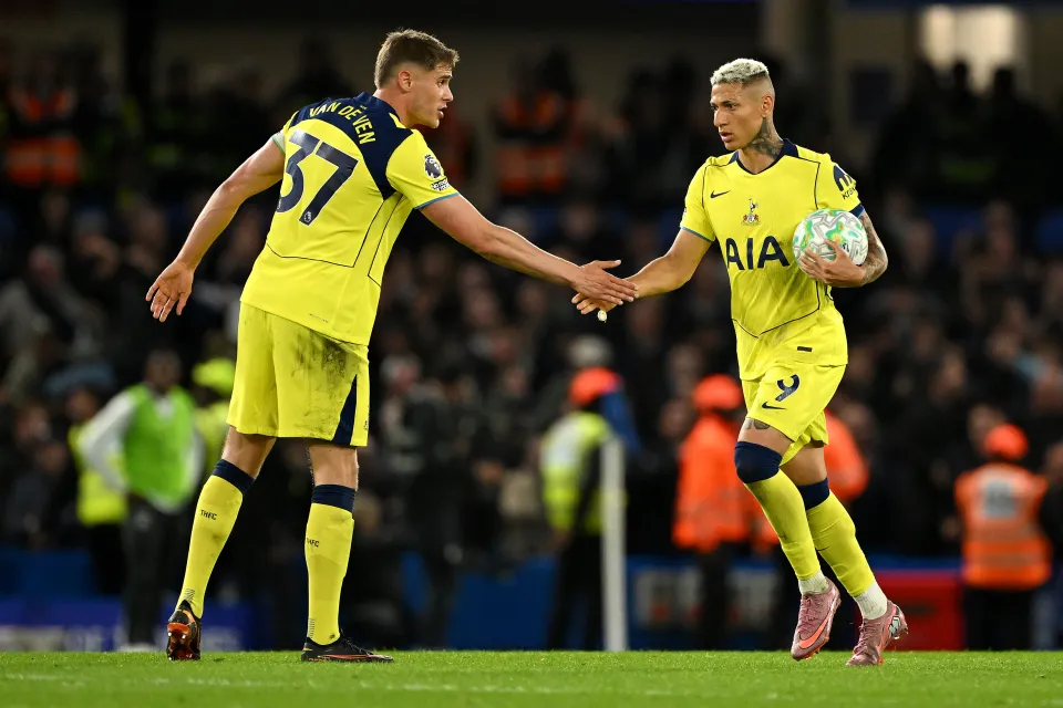 Micky van de Ven and Richarlison shake hands after the Brazilian scored at Chelsea