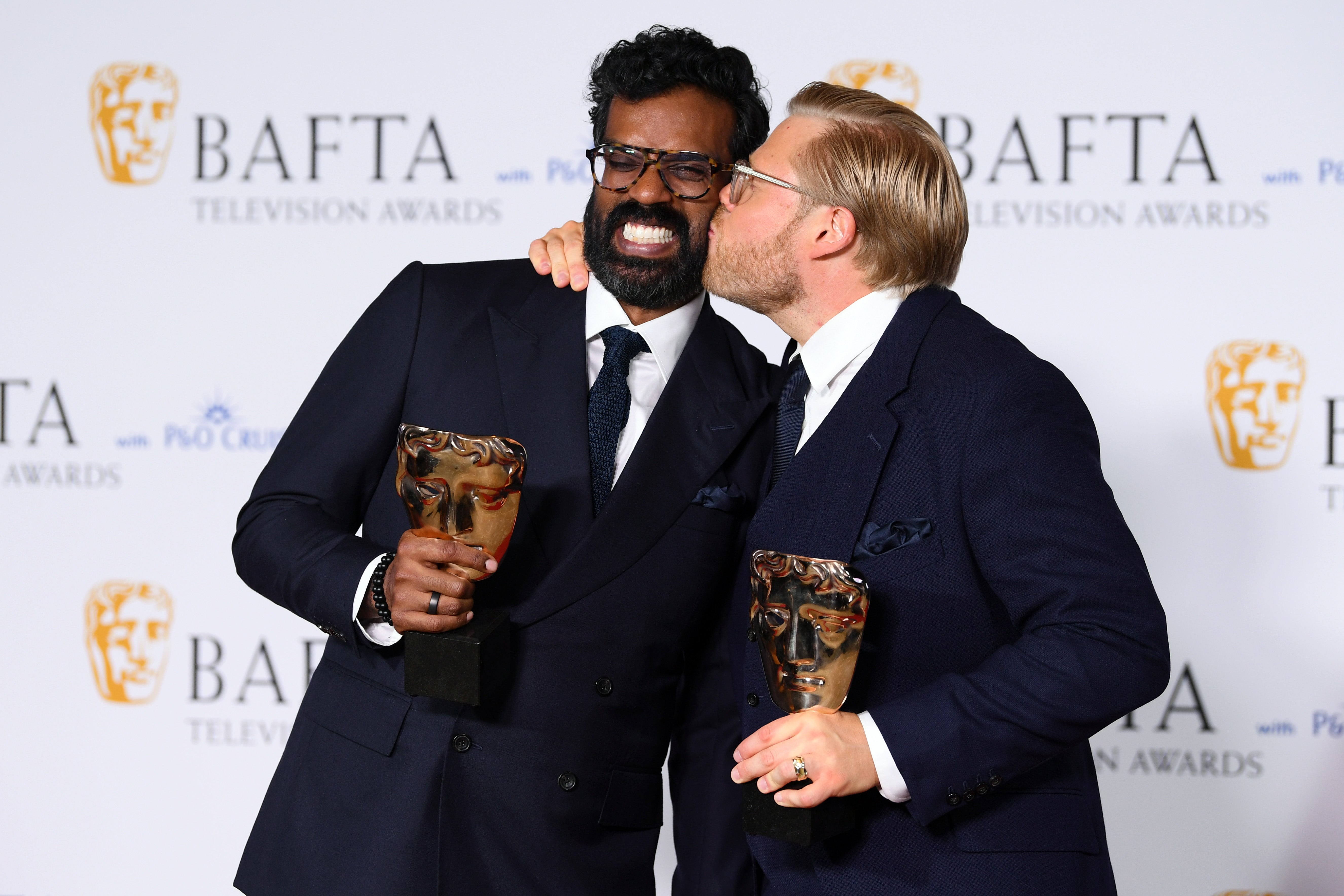 Romesh Ranganathan and Rob Beckett pose with the Entertainment Performance Award at the 2024 Baftas