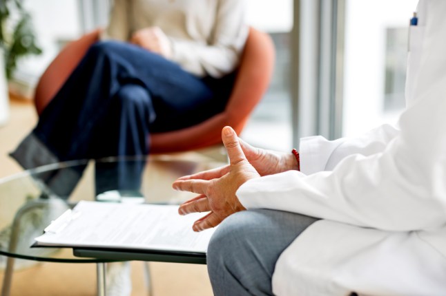 Close-up Shot of female doctors Hands while talking to a patient