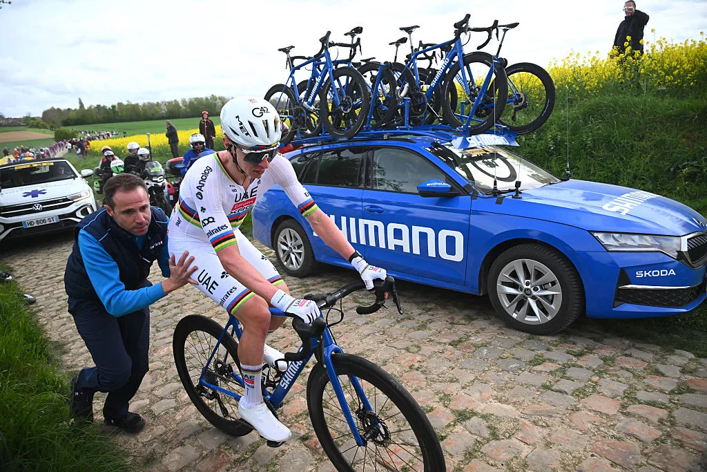 UAE Team Emirates XRG's Slovenian rider Tadej Pogacar changes his bike after a flat tire during the 123rd edition of the Paris-Roubaix one-day classic cycling race, 258.3 km between Compiègne and Roubaix, northern France, on April 12, 2026. (Photo by Etienne GARNIER / POOL / AFP via Getty Images)