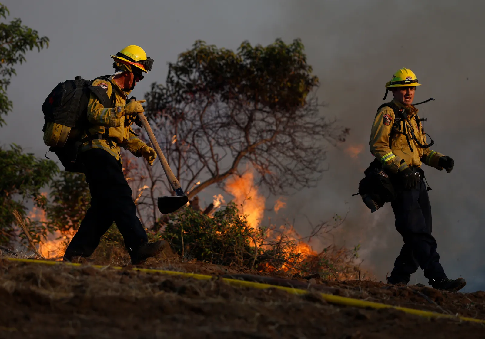 Cal Fire firefighters battle the Sandy Fire on May 18, 2026, in Simi Valley, California.