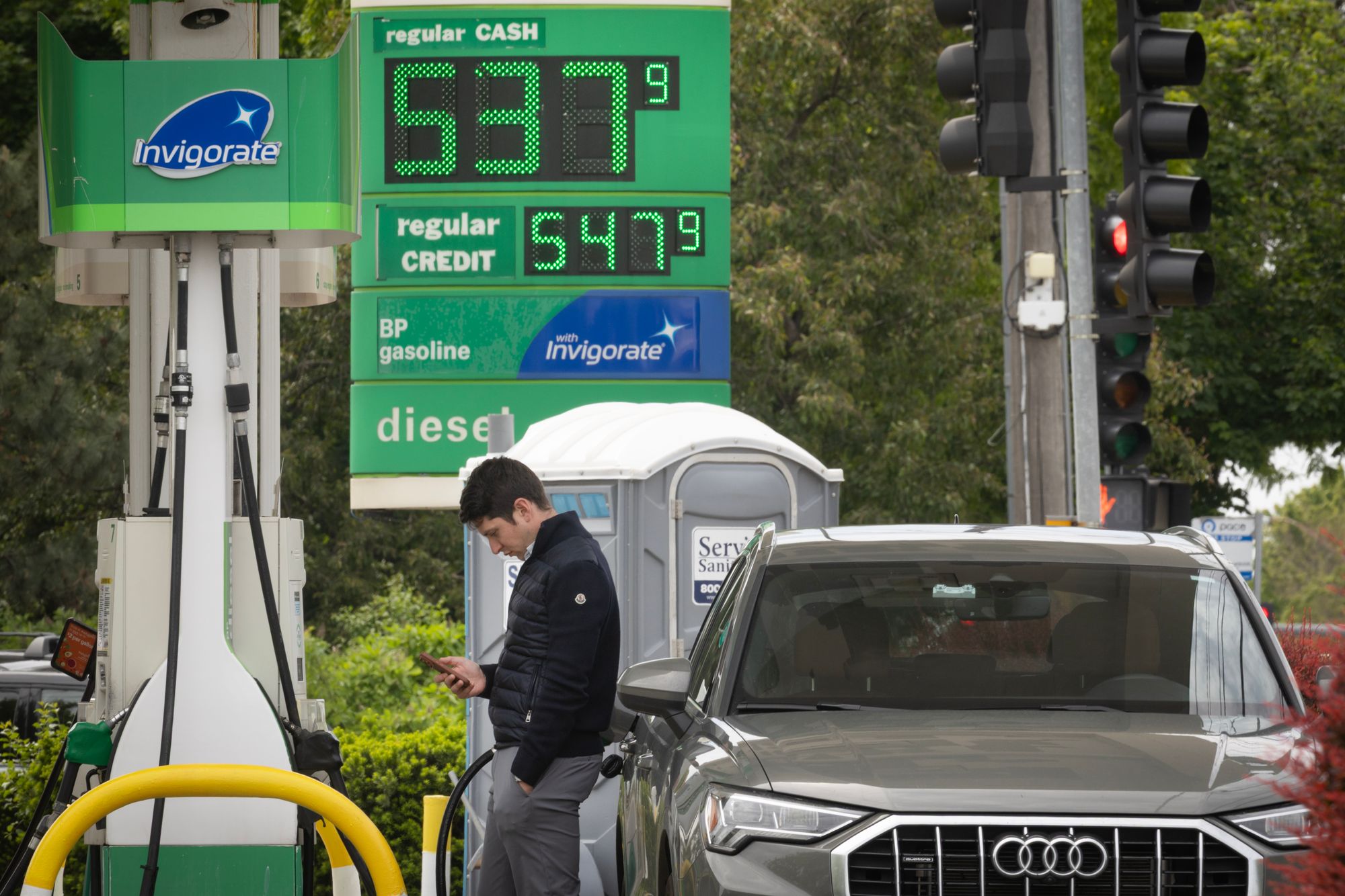 On Tuesday, the national average price for a gallon of gasoline stood at $4.49 per gallon, according to AAA. Pictured here, a man fills up his car in Illinois over Memorial Day weekend