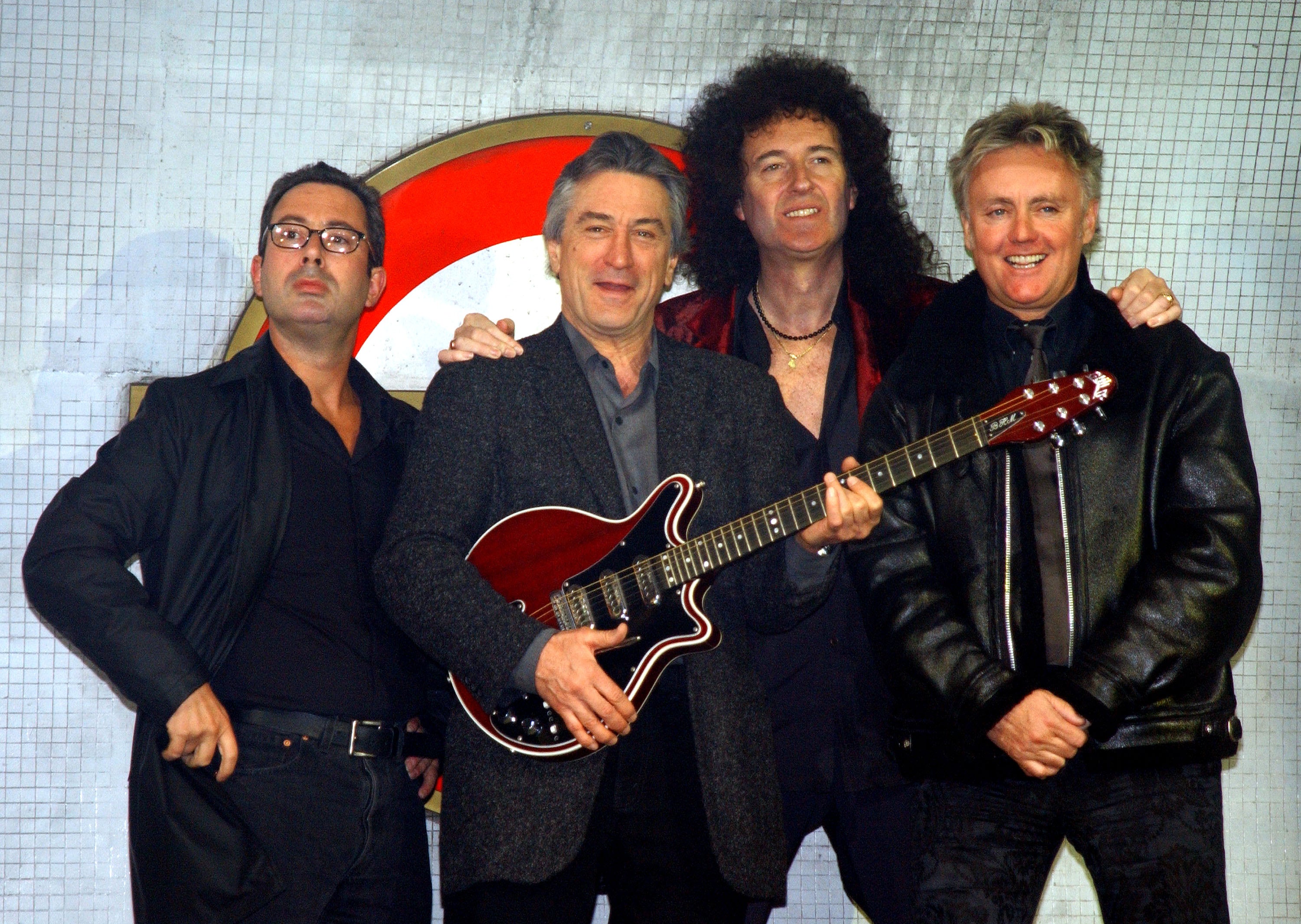 Elton at the launch of the musical 'We Will Rock You' in 2002, alongside Queen's Brian May and Roger Taylor, and producer Robert De Niro