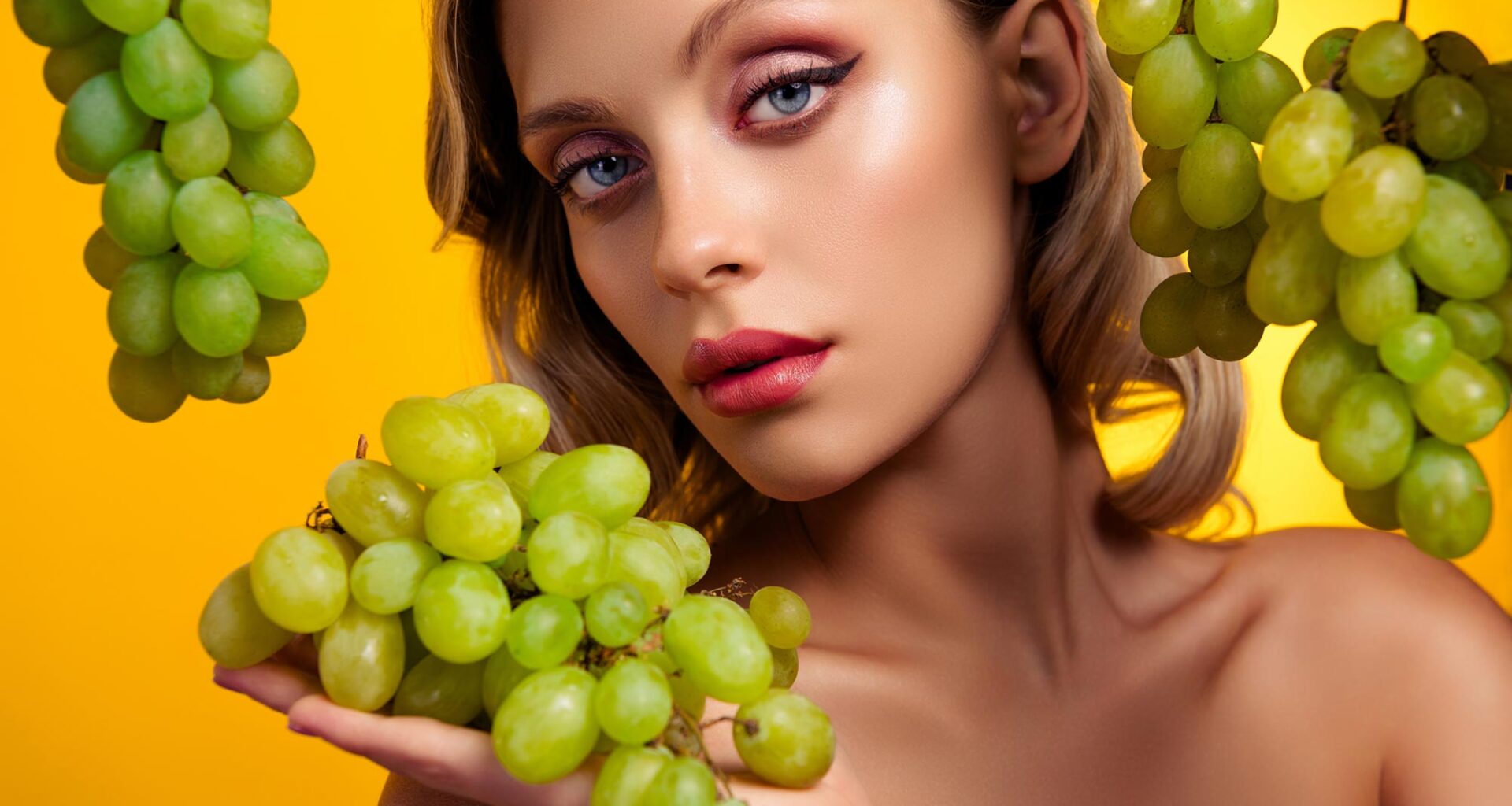 Glamour Model Posing Grapes