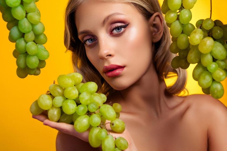 Glamour Model Posing Grapes