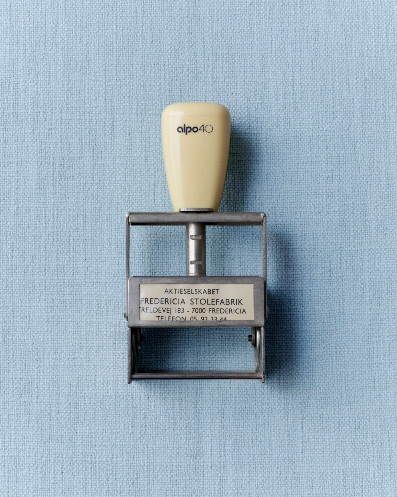 Archival sketches, pictures, and materials from iconic designs, placed atop pastel-colored backgrounds and photographs from above.