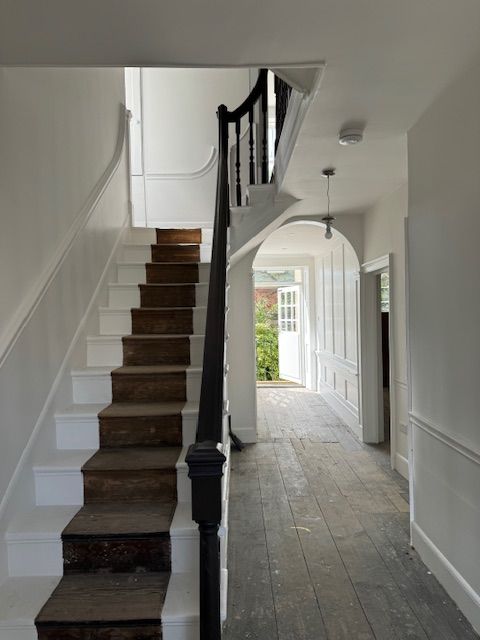 Image may contain Architecture Building House Housing Staircase Indoors Foyer and Lamp