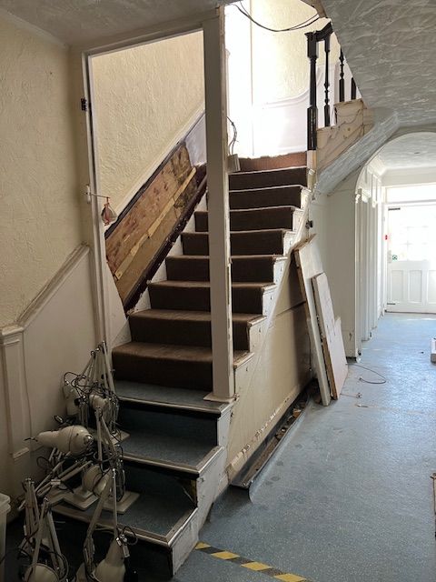 Image may contain Architecture Building House Housing Staircase Foyer and Indoors