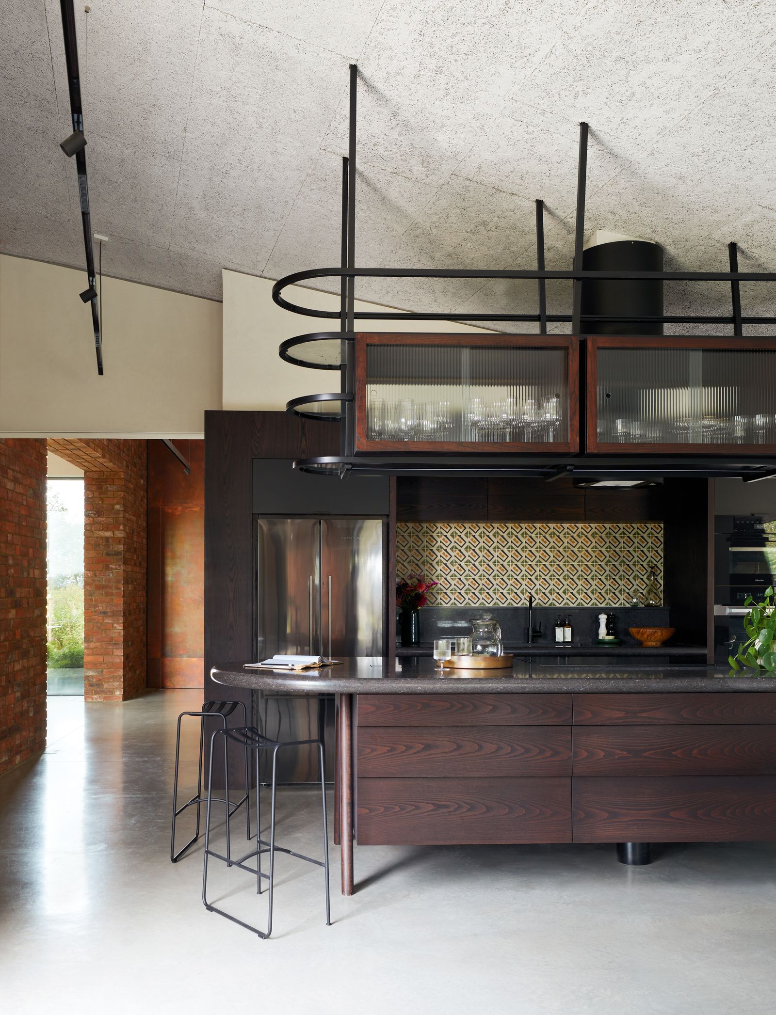 Image may contain Indoors Interior Design Kitchen Architecture Building House Housing Loft Room and Kitchen Island