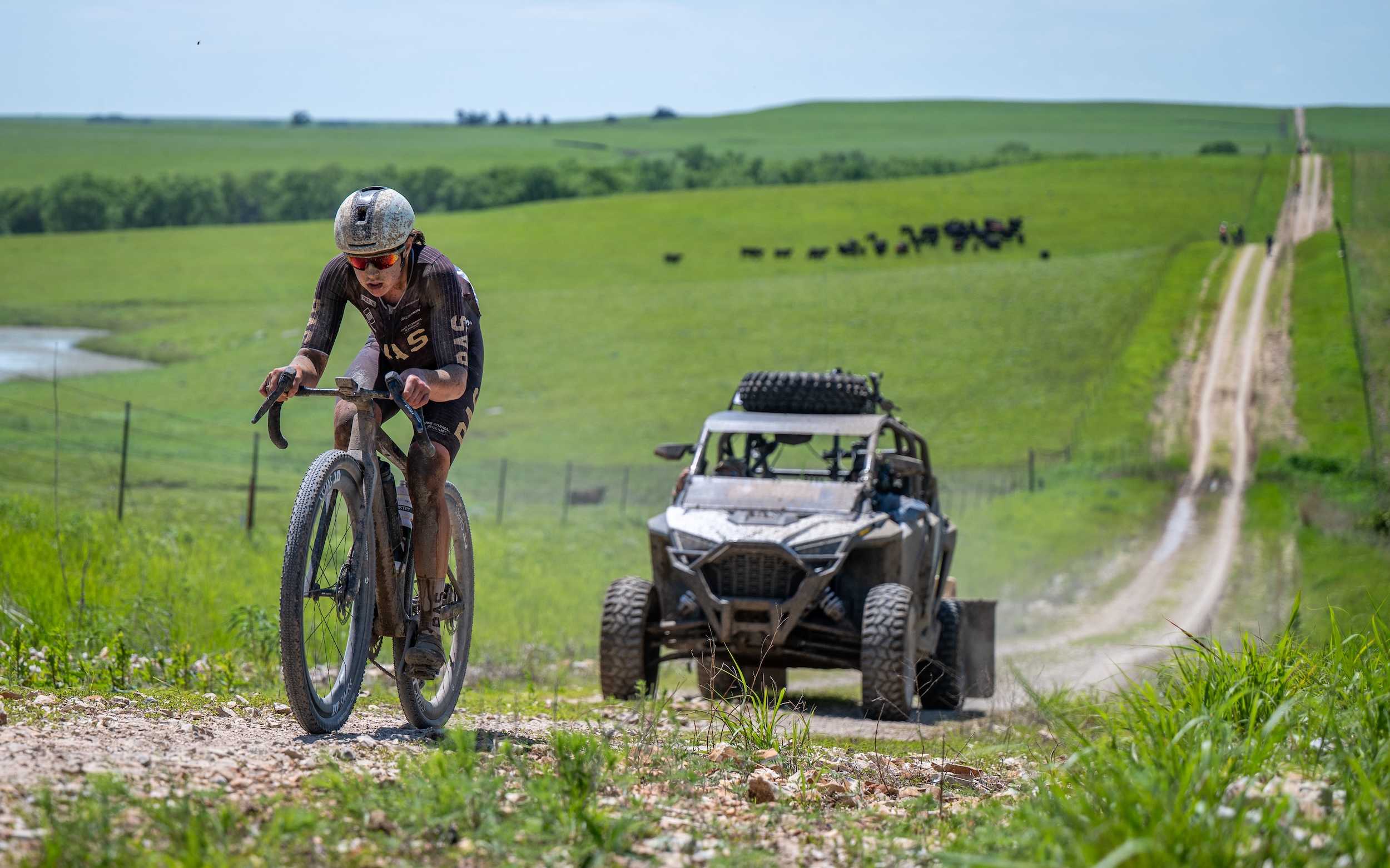 A solo move by 2025 Unbound Gravel 200 winner Karolina Migoń is captured by Life Time cameras from an off-road motor vehicle
