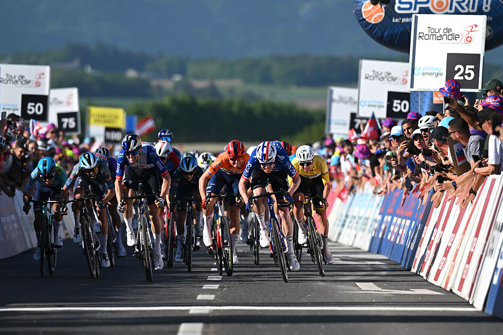 ORBE, SWITZERLAND - MAY 01: (L-R) Valentin Paret-Peintre of France and Team Soudal Quick-Step, Finn Fisher-Black of New Zealand and Team Red Bull - BORA - hansgrohe, Albert Withen Philipsen of Denmark and Team Lidl - Trek - Orange Points Jersey, stage winner Dorian Godon of France and Team INEOS Grenadiers and Tadej Pogacar of Slovenia and UAE Team Emirates - XRG - Yellow Leader Jersey during the 79th Tour de Romandie 2026, Stage 3 a 176.6km stage from Orbe to Orbe / #UCIWT / on May 01, 2026 in Orbe, Switzerland. (Photo by Dario Belingheri/Getty Images)
