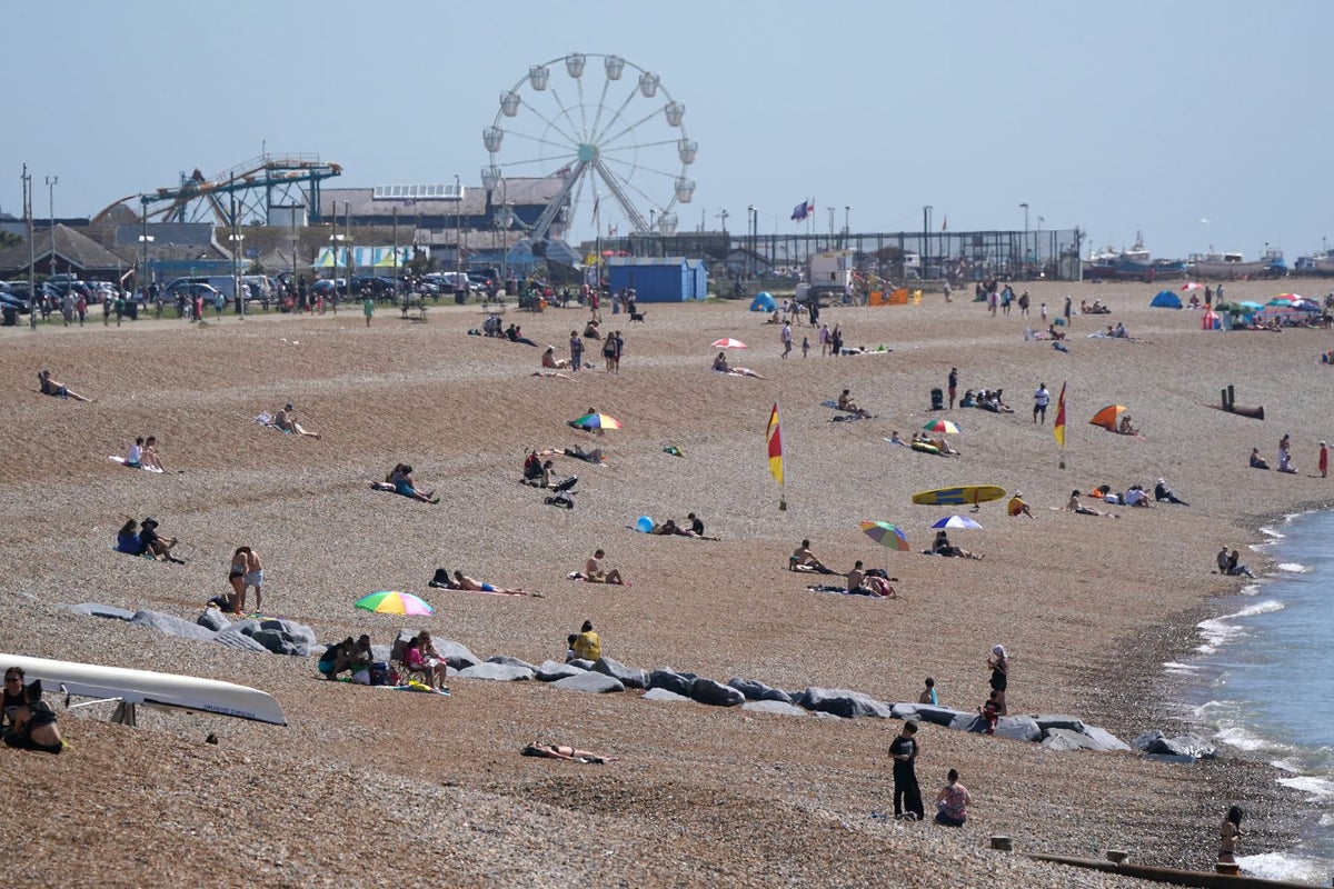 Man dies on packed beach on hottest day of the year after ‘medical emergency’