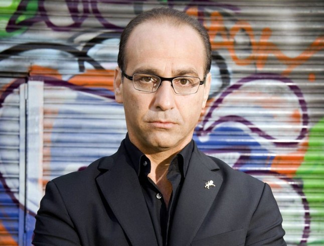 Television programme : DRAGONS DEN. Picture Shows: Theo Paphitis TX BBC TWO 2 August 2006 Two new dragons join the fire breathing milionaire investors in the third series of the award-winning, BAFTA-nominated Dragons' Den, presented by BBC Economics Editor Evan Davis. New dragons, Richard Fairleigh and Deborah Meaden, line up alongside Peter Jones, Duncan Bannatyne and Theo Paphitis. They'll come face to face with a fresh batch of hopeful dragon slayers seeking investment in the den. WARNING: Use of this copyrighted image is subject to Terms of Use of BBC Digital Picture Service. In particular, this image may only be used during the publicity period for the purpose of publicising 'Dragons Den' and provided the BBC is credited. Any use of this image on the internet or for any other purpose whatsoever, including advertising or other commercial uses, requires the prior written approval of BBC
