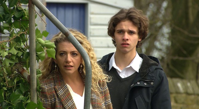 Maya and Jacob hiding in the Emmerdale village