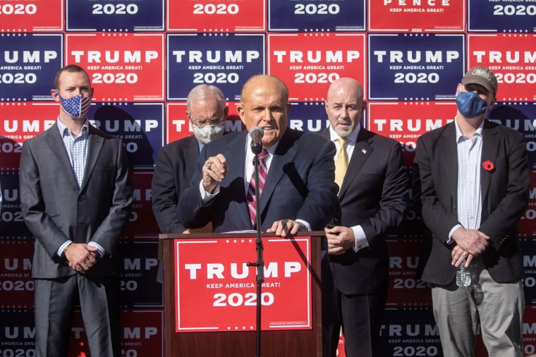 PHILADELPHIA, PENNSYLVANIA - NOVEMBER 07: Attorney for the President, Rudy Giuliani speaks to the media at a press conference held in the back parking lot of landscaping company on November 7, 2020 in Philadelphia, Pennsylvania. The press conference took place just minutes after news networks announced that Joe Biden had won the presidency over Donald Trump after it was projected that he had won the state of Pennsylvania. (Photo by Chris McGrath/Getty Images)
