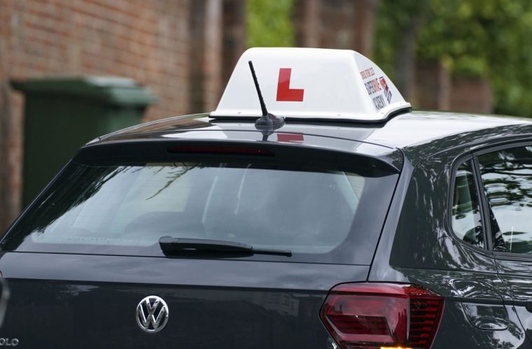 Embargoed to 0001 Monday December 13 File photo dated 20/05/21 of a driving school car. More than half a million learner drivers are waiting to take their test amid a huge backlog, figures reveal. Issue date: Monday December 13, 2021. PA Photo. AA Driving School, which obtained data from the Driver and Vehicle Standards Agency (DVSA), said the queue for tests is 