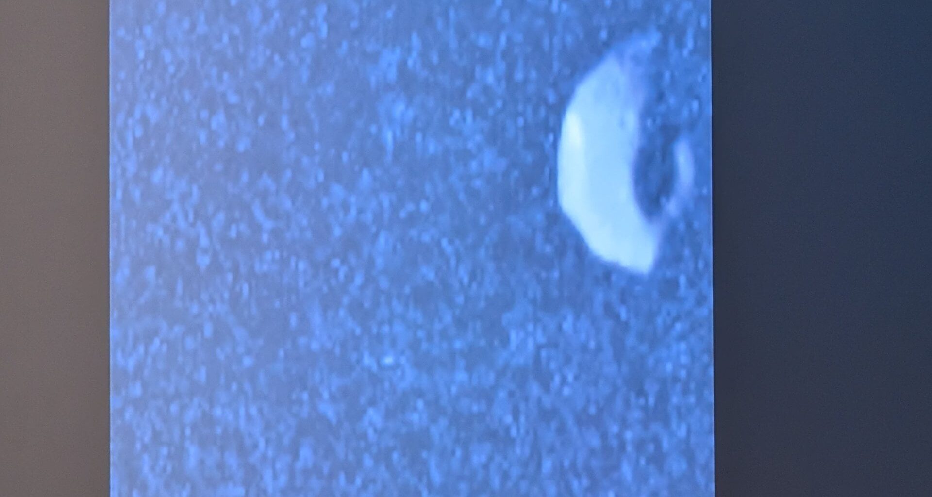 New NASA Juno image of Jupiter's tiny moon of Thebe presented at the EGU26 general assembly early this month. Credit: NASA via Bruce Dorminey