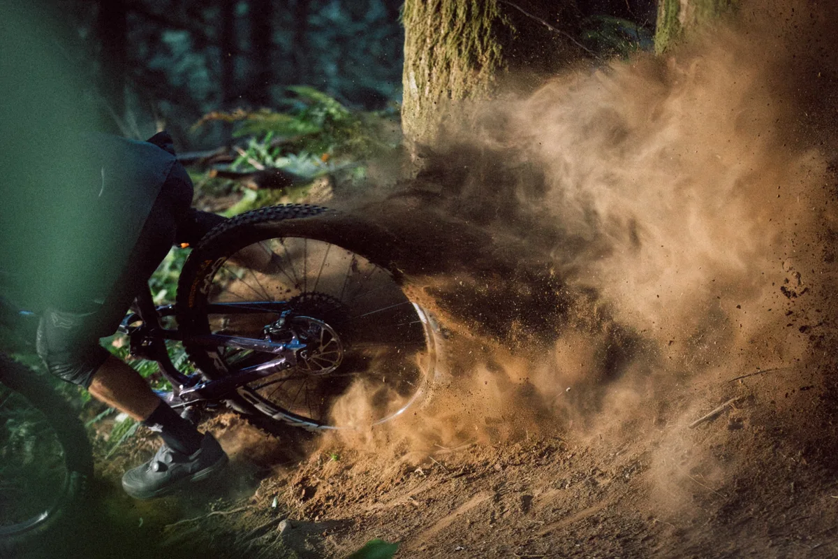 Race Face Era wheels being scralped through a turn kicking up dust.