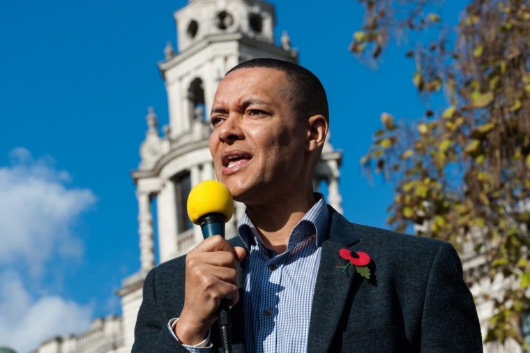 LONDON, UNITED KINGDOM - OCTOBER 31: Labour Party MP Clive Lewis addresses hundreds of activists and campaigners in London's Parliament Square during 'Extinction Rebellion' protest against the inaction of the British government in the face of climate change and ecological collapse. Protesters declared a non-violent rebellion and demanded urgent action on the ecological crisis to avoid the possibility of human extinction in the near future. October 31, 2018 in London, England. (Photo credit should read Wiktor Szymanowicz/Future Publishing via Getty Images)
