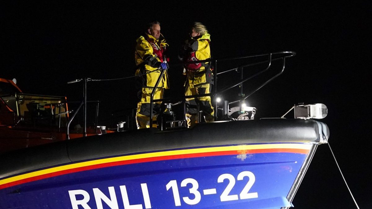 BRIDLINGTON, ENGLAND - MARCH 10: Crew members stand on the bow as the Royal National Lifeboat Antony Patrick Jones returns safely with crew to Bridlington RNLI station after taking part in rescue operations after two vessels collided in the North Sea on March 10, 2025 in Bridlington, England. Thirty-two people were reportedly brought ashore with injuries after the collision of the oil tanker Stena Immaculate and the Solong, a cargo vessel, on Monday morning. (Photo by Ian Forsyth/Getty Images)