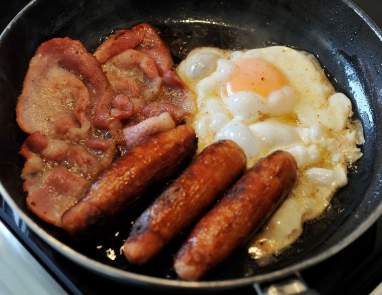 Embargoed to 2330 Tuesday July 29 File photo dated 27/0814 of an egg, sausages and bacon being fried in a frying pan. Academics have found a link between consuming high levels of ultra processed foods (UPFs) and lung cancer. An international team of researchers tracked the health and food habits of more than 100,000 US adults, with an average age of 63. After an average of 12 years the team identified 1,706 cases of lung cancer. Issue date: Tuesday July 29, 2025. PA Photo. Photo credit should read: Nicholas.T.Ansell/PA Wire