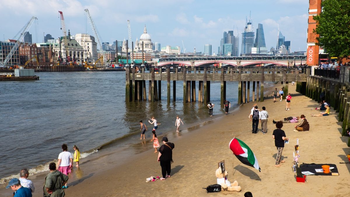 People gathering in the river Thames in South Bank in London, United Kingdom. The Thames may not be the first place that springs to mind when you fancy a swim, but with Londons most famous waterway now cleaner than its been for 150 years, wild swimming is on the up.